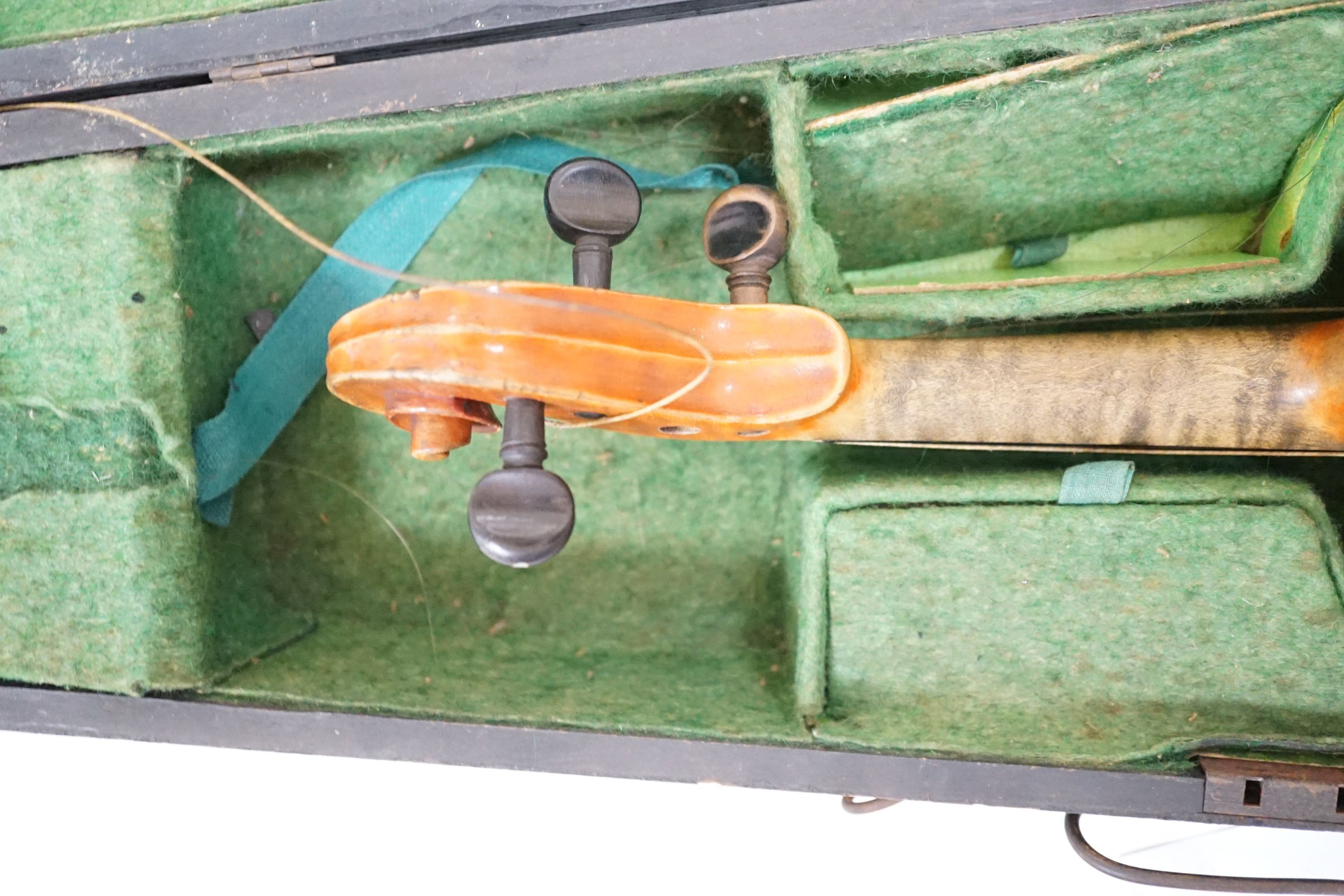 A 19th century 3/4 size violin, cased with 2 bows and 1 other German violin